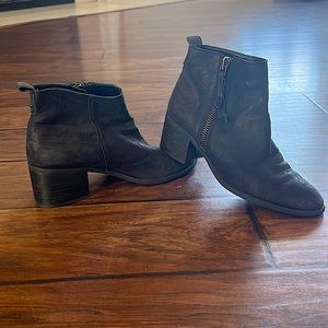 Black zip up distressed leather ankle bootie